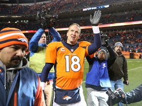 Denver Broncos QB Peyton Manning waves to the crowd after a playoff win on Jan. 12 (Matthew Emmons-USA TODAY Sports)