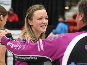 Skip Chelsea Carey hugs father and coach Dan Carey after beating Kerri Einarson 6-2 in the 2014 provincial Scotties Tournament of Hearts final at Tundra Oil and Place in Virden, Man., on Sun., Jan. 12, 2014. Kevin King/Winnipeg Sun/QMI Agency