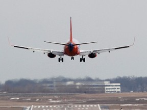 A Southwest Airlines jet lands at the Lambert - St. Louis International Airport, in St. Louis, Missouri in this March 4, 2013 file photo. (REUTERS/Tom Gannam)