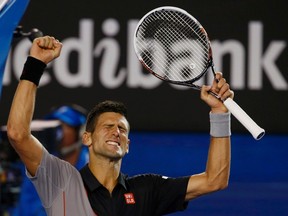 Novak Djokovic celebrates defeating Lukas Lacko at the Australian Open in Melbourne on Monday, Jan. 13, 2014. (David Gray/Reuters)