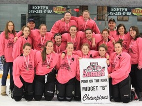Members of the Mitchell Midget girls hockey team pose with their pink uniforms - a fundraiser for breast cancer - after winning the B title in the South Huron tournament Jan. 10-12. SUBMITTED PHOTO