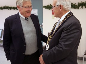Tillsonburg Mayor John Lessif (right) shares a laugh with Oxford MPP Ernie Hardeman Sunday afternoon at the conclusion of the 2014 Mayor’s Levee at the Annandale National Historic Site. During a brief address, Lessif suggested his priorities would be to sell Tillsonburg hydro and buy Rolph Street Public School as a site for consolidated municipal offices. Jeff Tribe/Tillsonburg News