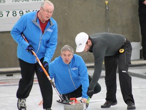 Baker Hughes skip Wayne Heikkinen watches as lead Ken Purnell and second Chris Heikkinen help the rock on its way down the sheet during the ‘A’ event final of the 49th annual Oilmen’s Bonspiel on Jan. 12. Baker Hughes went on to win the ‘A’ event over CCM. Teams from Brandette Well Servicing, King’s Energy Services and Can-Vac Oilfield Services won the ‘B’, ‘C’ and ‘D’ events respectively.