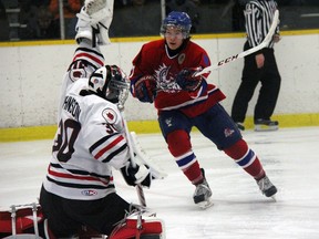 Strathroy Rockets forward Wes Baker tries to tip a shot past Strathroy Legionnaires goalie Hunter Johnson during GOJHL action Saturday at the West Middlesex Memorial Centre. The Rockets lost their second straight by a count of 3-2.
JACOB ROBINSON/AGE DISPATCH/QMI AGENCY