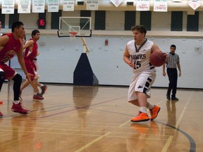 Fred Small Legs (left) keeps Jared Duffield in front of him during the first quarter of Piikani’s dominating victory. Greg Cowan photo/QMI Agency