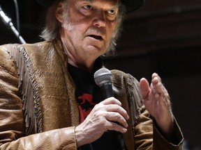 Canadian singer Neil Young takes part in press conference against the oilsands at Massey Hall in Toronto on January 12, 2014. (Craig Robertson/QMI Agency)