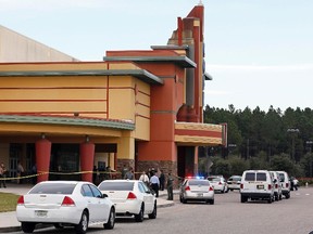 Police tape surrounds the Cobb Grove 16 movie theater in Wesley Chapel, Florida January 13, 2014. (REUTERS/Mike Carlson)