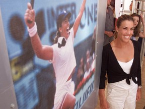 American Jennifer Capriati poses by a picture at 15, winning the 1991 Canadian Open. (Greg Henkenhaf/Toronto Sun/QMI Agency)