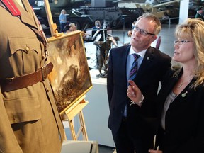 Mark O'Neill, CEO of the Canadian Museum of Civilization Corp., shows Heritage Minister Shelly Glover some First World War artifacts at the Canadian War Museum on Monday, January 13, 2014 after Glover announced her government's plans to commemorate anniversaries of both world wars. (David Akin/QMI Agency)