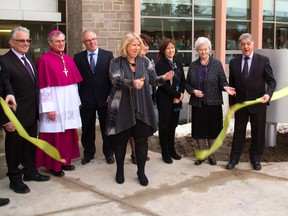 Health minister Deb Matthews cuts the ribbon at the opening of the St. Joseph's Hospice on Windermere Road in London, Ont. on Monday January 13, 2014. Mike Hensen/The London Free Press/QMI Agency
