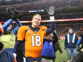 Broncos quarterback Peyton Manning walks off the field after defeating the Chargers on Sunday. (USA TODAY SPORTS)