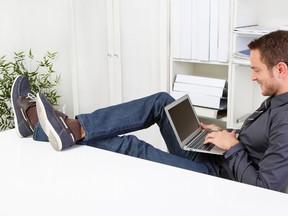 A man uses a laptop computer.