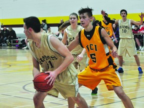 Kenton Kroeker of the PCI Trojans varsity basketball team defends during the Trojans' 88-48 win over Stonewall Jan. 13. (Kevin Hirschfield/THE GRAPHIC/QMI AGENCY).
