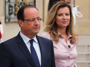 French President Francois Hollande and first lady Valerie Trierweiler accompany guests following a meeting at the Elysee Palace in Paris in this October 1, 2013 file photo. REUTERS/Philippe Wojazer/Files