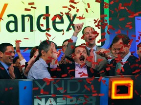 Yandex founder and CEO Arkady Volozh (front, 2nd R) celebrates as Yandex is listed on the Nasdaq exchange during their IPO at the Nasdaq market site in New York May 24, 2011. REUTERS FILE/Mike Segar