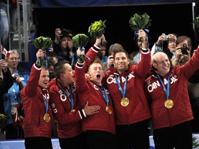 Canada's men's curling team shows off their gold medals at the Vancouver Olympics in this 2010 file photo. (DANIEL MALLARD/QMI AGENCY)