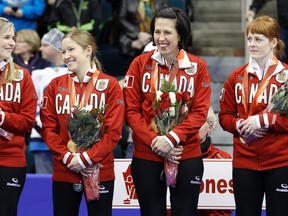 Skip Jennifer Jones, third Kaitlyn Lawes, second Jill Officer, and lead Dawn McEwen on the podium after winning the women's final last month. (Trevor Hagan/Getty Images/AFP file photo)