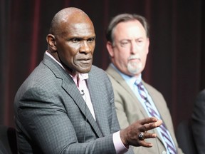 (L-R) NFL Hall of Famer Harry Carson and investigative reporter and author Mark Fainaru-Wada speak onstage during the "League of Denial: The NFL's Concussion Crisis" panel at the PBS portion of the 2013 Summer Television Critics Association tour at the Beverly Hilton Hote in Beverly Hills, California last summer.  (Frederick M. Brown/Getty Images/AFP)
