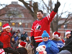 MP Dean Del Mastro waves to the crowd during the 40th annual Kinsmen Santa Claus parade down George St. on Saturday, December 7, 2013 in Peterborough, Ont. Clifford Skarstedt/Peterborough Examiner/QMI AGENCY