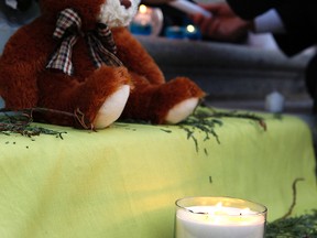 A March 11, 2010, candle-light vigil on the steps of the Alberta Legislature after the death of a 21-month-old foster child. A Morinville woman accused of causing the death of the child in her care began a manslaughter trial in an Edmonton court on Monday. (EDMONTON SUN FILE)