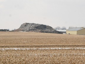 The big wood pile west of Norwich on Norwich Road was to be burned under a special permit issued by the township, but now that the pile is deemed to be waste, the Environmental Protection Act won't allow for burning. FILE PHOTO