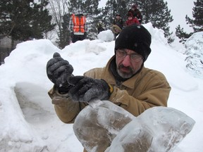 Corunna's Jeffrey Rafuse works, in this file photo, on a series of ice sculptures at Snowfest in 2011. This year's Snowfest is happening Feb. 7, 8, and 9, at a new location, still to be announced.
PAUL MORDEN/THE OBSERVER/QMI AGENCY