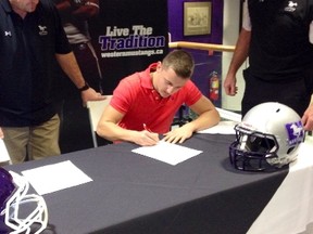 Mitchell Smiley is a grade 12 student at Northern who is committed to Western University to play football beginning in the fall of 2014. The running back, who is pictured above signing with the Western Mustangs, has been selected to play for Team Ontario in the International Bowl against Team USA on Feb. 8 in Dallas, Texas.  (Submitted photo)