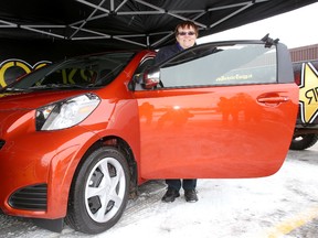 Carmen Blondin with her new car she won from Mac's Convenience Stores and Rockstar Energy Drinks in Kingston on Wednesday. 
IAN MACALPINE/KINGSTON WHIG-STANDARD/QMI AGENCY