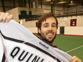 Jimmy Quinlan displays his jersey during the official announcement of his captaincy in January, 2012. (Ian Kucerak, Edmonton Sun)