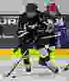 Whitemud West Thunderkings' Steele Bailey (in white) pursues SWAT Stars' Ashwin Kaul (in black) during Quikcard Edmonton Minor Hockey Week action at Mill Woods Recreation Centre in Edmonton, Alta., on Wednesday, Jan. 15, 2014. Codie McLachlan/Edmonton Sun/QMI Agency