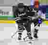 Whitemud West Thunderkings' Steele Bailey (in white) pursues SWAT Stars' Rishi Mahant (in black) during Quikcard Edmonton Minor Hockey Week action at Mill Woods Recreation Centre in Edmonton, Alta., on Wednesday, Jan. 15, 2014. Codie McLachlan/Edmonton Sun/QMI Agency
