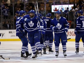 Toronto players celebrate as the Toronto Maple Leafs defeated the Buffalo Sabres 4-3 on Wednesday. (Michael Peake/Toronto Sun/QMI Agency)