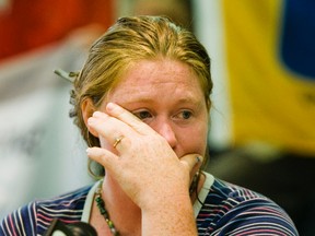 Kimberly Rivera wipes a tear during a press conference  at the United Steelworkers of America building  in Toronto on Friday August 31, 2012.