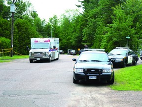 RYAN PAULSEN/DAILY OBSERVER
Police corden off a crime scene on East Street at Petawawa Point on June 28, 2013. Dan Pietersma was killed during an attack at his home. Brian Goddard has been charged with first degree murder and attempted murder.