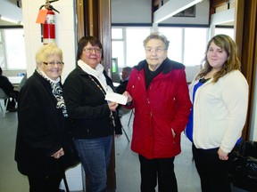 Mary-Ruth Circle treasurer Vi Atamaniuk, center-right, presents a cheque for $579 to the executive director of the Kenora Fellowship Centre, Yvonne Bearbull. Also pictured: Circle member Ruth Bergman, far left, and Fellowship Centre outreach coordinator Taylor Haney.