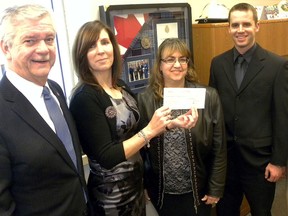 Quinte West Mayor John Williams presents a cheque for $7,919 to Meribeth deSnoo, executive director of the Hastings and Prince Edward Food for Learning Foundation. Looking on are program coordinator Kellie Brace, Eric LaCourt of Wilkinson and Co. and foundation board member David Clazie.