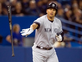 New York Yankees Alex Rodriguez tosses his bat after flying out against the Toronto Blue Jays in the ninth inning of their American League MLB baseball game in Toronto in this file photo from September 18, 2013. (REUTERS/Fred Thornhill/Files)