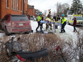 A vehicle rolled onto the sidewalk, drove through a fence and rammed into the side wall of Egerton Baptist Church after colliding with a Dodge Journey Thursday afternoon. Mike Hensen/The London Free Press/QMI Agency