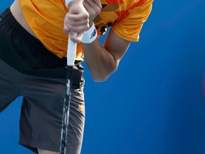 Milos Raonic of Canada hits a return to Victor Hanescu of Romania during their men's singles match at the Australian Open 2014 tennis tournament in Melbourne January 16, 2014. (REUTERS/Brandon Malone)