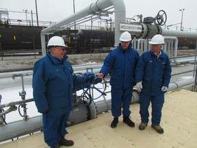 Nova Chemicals celebrated the arrival of natural gas liquids ethane feedstock at its Corunna facility, arriving by pipeline from the Marcellus shale region of the U.S. From left, Sarnia-Lambton MPP Bob Bailey, Nova CEO Randy Woelfel and Tom Thompson, Nova's manufacturing director in Sarnia. Tapping in to the lower-priced feedstock has turned around the outlook for the plant located in St. Clair Township. Sanria, Ont., Jan. 16, 2013  (PAUL MORDEN/THE OBSERVER/QMI AGENCY)