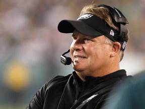 Philadelphia Eagles head coach Chip Kelly smiles from the sideline while playing against the New England Patriots in Philadelphia, Pennsylvania, in this file photo taken August 9, 2013. Kelly was named Pro Football Coach of the Year by the Maxwell Football Club on Thursday. (REUTERS/Tim Shaffer/Files)