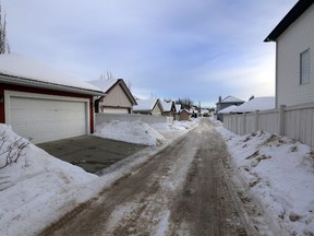 Police investigates some alleys in Terwillegar Towne in Edmonton, AB., on Thursday, Jan 16, 2014.  There has been several reports of assaults on woman in the area.  Perry Mah/Edmonton Sun