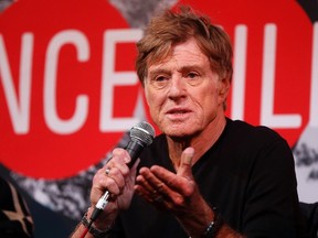 Actor Robert Redford addresses the media at an opening day news conference for the Sundance Film Festival at the Egyptian Theatre in Park City, Utah, January 16, 2014. (REUTERS/Jim Urquhart)