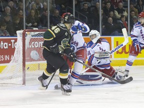 London Knights forward Matt Rupert sinks a backhanded shot past Kitchener Rangers goalie Matthew Greenfield during the third period of their OHL game at Budweiser Gardens on Thursday night. The Knights won 6-2. (CRAIG GLOVER, The London Free Press)