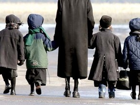 Lev Tahor children are walked home during the lunch hour from the makeshift school they attend in Chatham, Ont., Friday, November 29, 2013. (Diana Martin/QMI Agency)