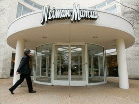 A shopper enters a Neiman Marcus store in Oak Brook, Ill., a suburb of Chicago, in this May 2, 2005 file photo. REUTERS/John Gress/Files