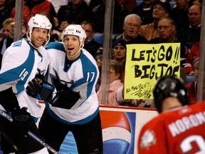San Jose Sharks centre Joe Thornton, left, celebrates with left winger and cousin Scott Thornton in this 2005 file photo.