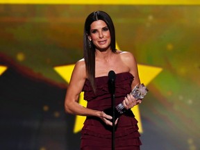 Sandra Bullock accepts the award for best actress in an action movie for "Gravity" at the 19th annual Critics' Choice Movie Awards in Santa Monica, California January 16, 2014.  REUTERS/Mario Anzuoni