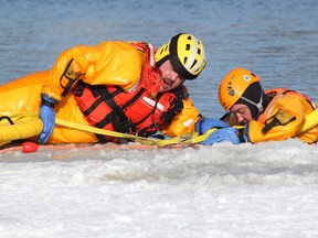 SEAN CHASE/DAILY OBSERVER
Town of Petawawa firefighters participate in ice rescue training during an exercise at Petawawa Point in January, 2011.