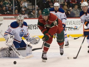Minnesota Wild forward Stephane Veilleux (19) reaches for a loose puck in the second period against Edmonton Oilers goaltender Ben Scrivens (30) at Xcel Energy Center. (Marilyn Indahl-USA TODAY Sports)